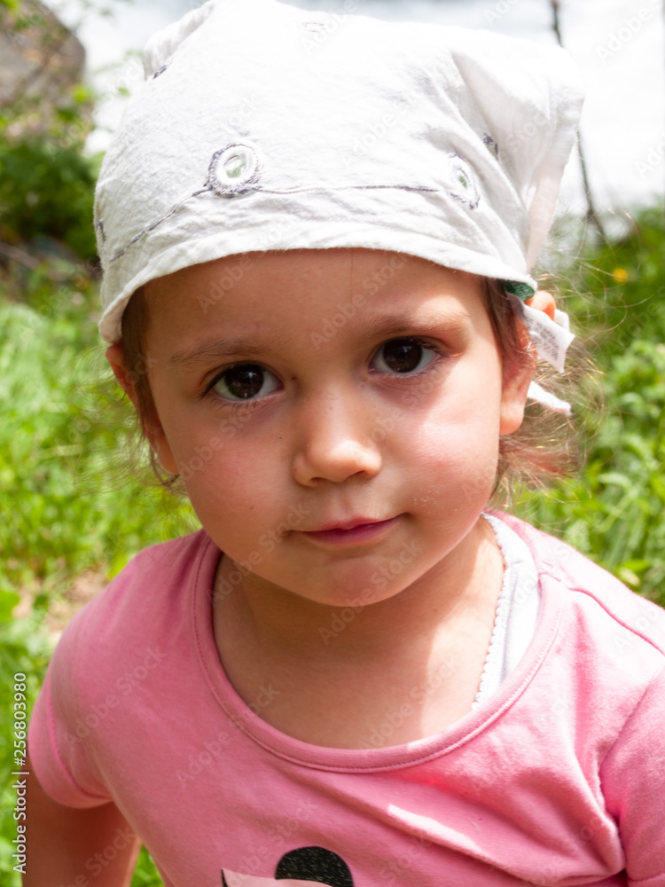 portrait of little baby girl with white scarf on her head portrait of little baby girl with white scarf on her head