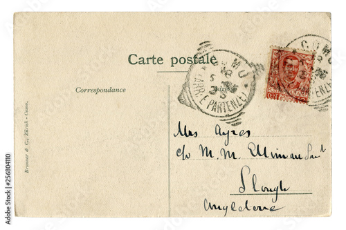 Back of historical french postcard: a letter with a red Italian postage stamp with portrait of king of Italy Victor Emmanuel III, postmark cancellation, The Italian Kingdom