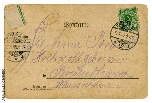 Back of historical German postcard: a letter with a green postage stamp and a Berlin postmark cancellation, 19.9.1899, Reich post, Germany, German Empire