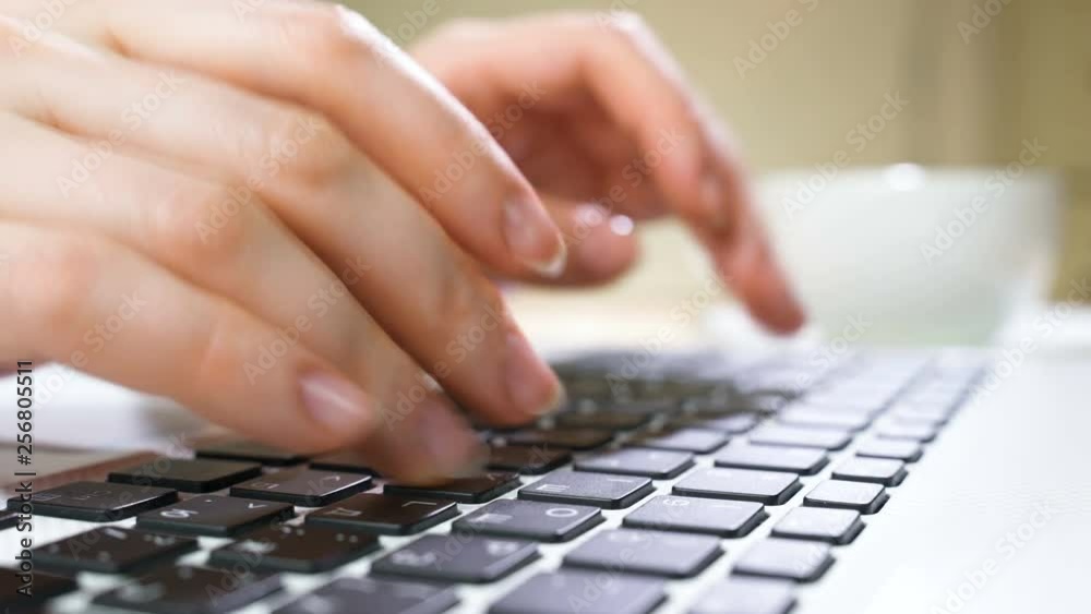 Businesswoman using laptop computer. Close up of female hand typing on laptop keyboard. Businesswoman using laptop computer. Close up of female hand typing on laptop keyboard.