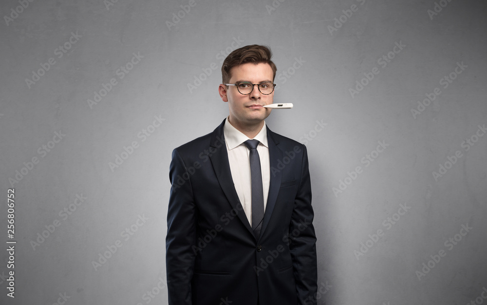 Young tired businessman with thermometer and copy space
Young tired businessman with thermometer and copy space