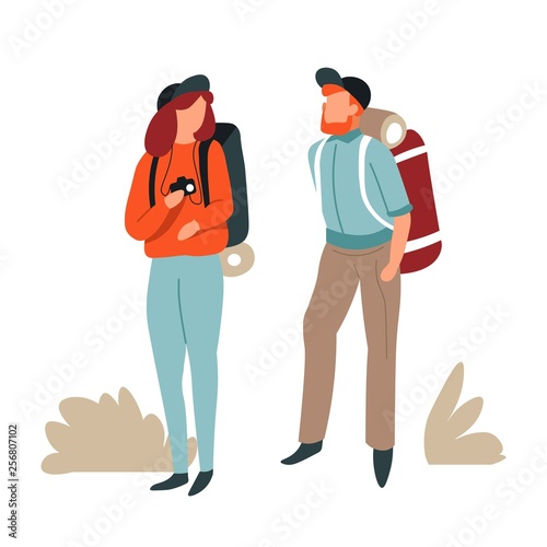 Hikers couple man and woman with backpacks and photo camera