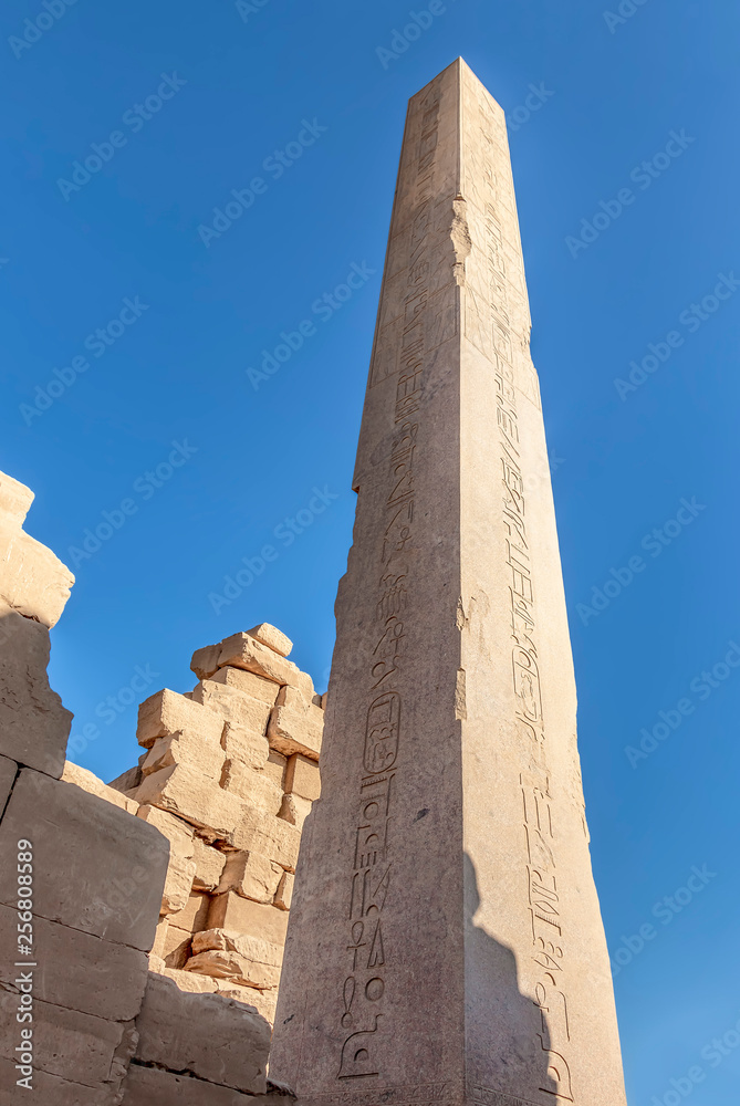 Granite obelisks in Karnak temple. Luxor, Egypt. Commonly known as Karnak, comprises a vast mix of decayed temples, chapels, pylons, and other buildings in Luxor, Egypt