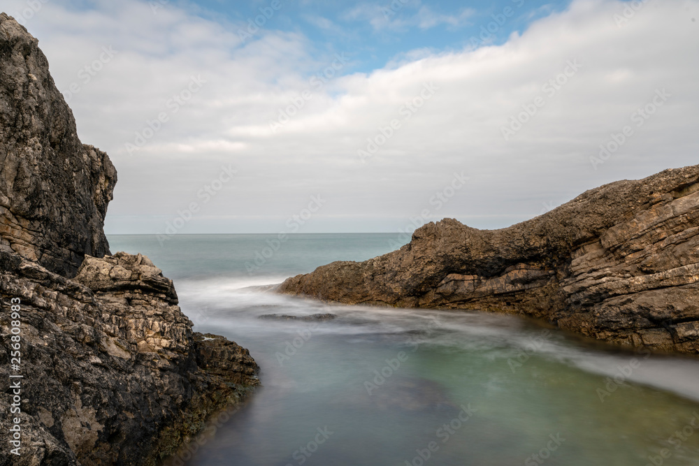 Black sea and the beach with rocks and waves with cloudy sky, Black sea and the beach with rocks and waves with cloudy sky,