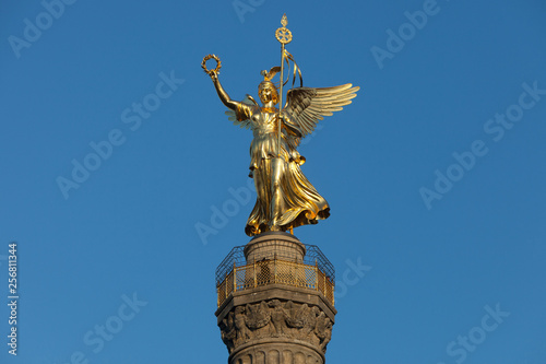 Victory Column angel Goldelse monument in Berlin Tiergarten in front of deep blue sky