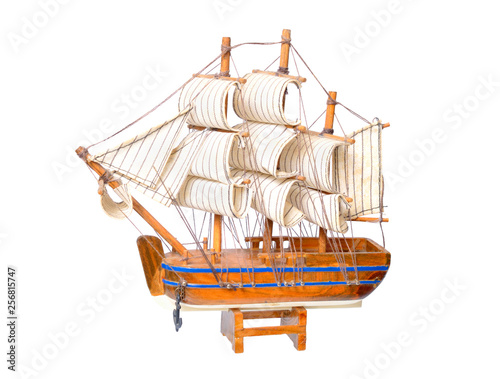 Small wooden souvenir boat isolated on white background