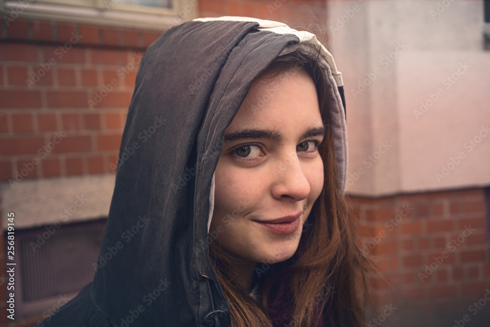 portrait of a smiling young woman with parka portrait of a smiling young woman with parka