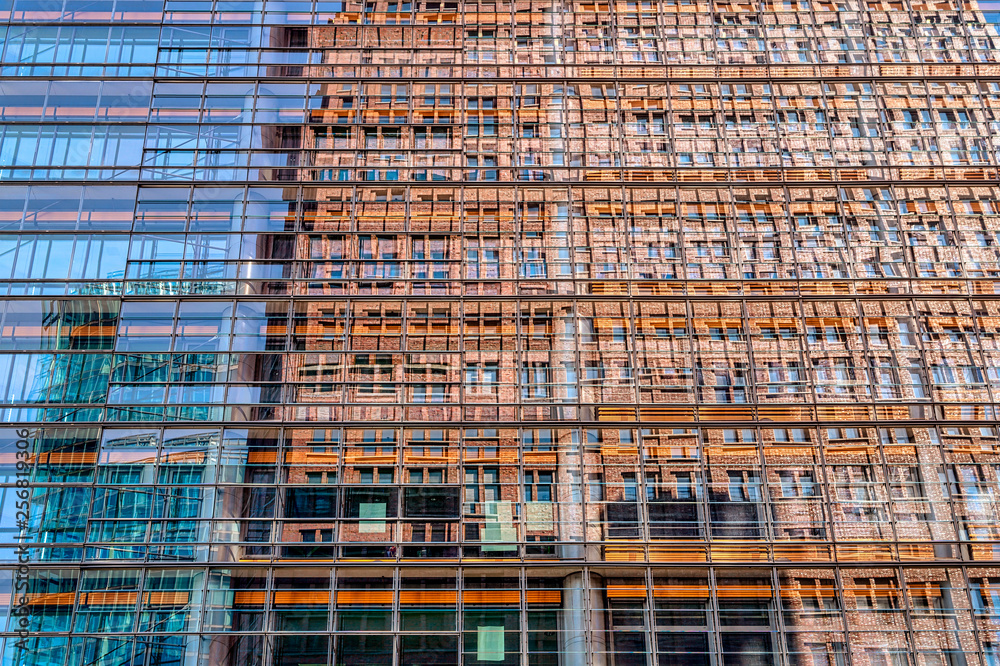 mirroring skyscraper in the windows of a skyscraper