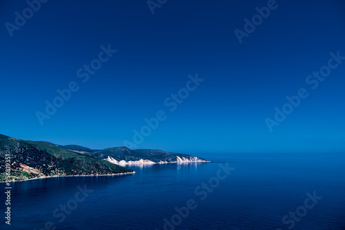 mediterranean landscape, promontory in the deep blue sea