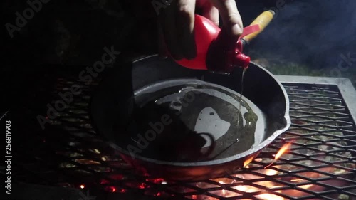 Camp dinner. Preparing food on a camp fire.