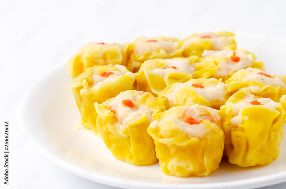 Chinese steamed shrimp dumplings on white dish Chinese steamed shrimp dumplings on white dish