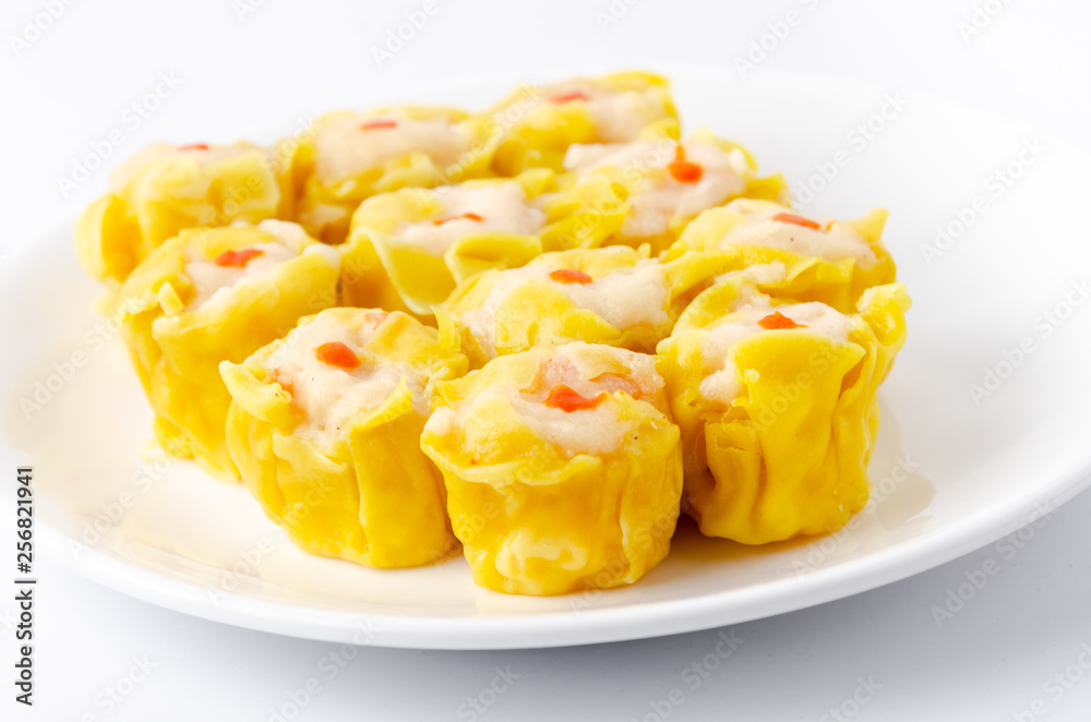 Chinese steamed shrimp dumplings on white dish Chinese steamed shrimp dumplings on white dish