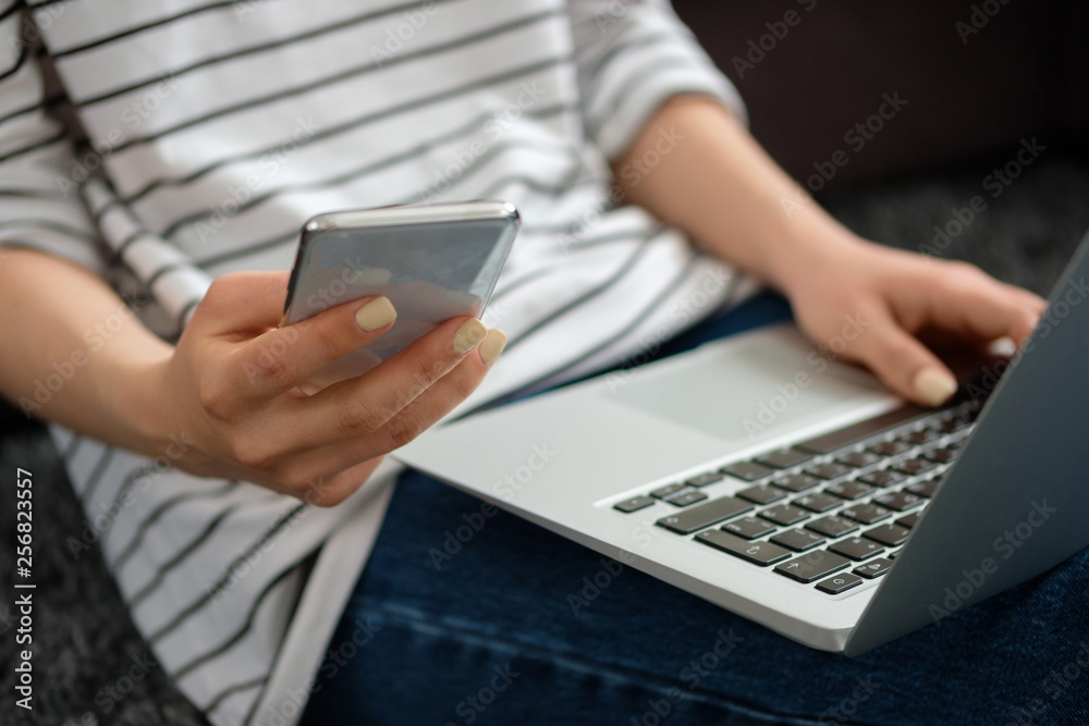 The girl works at the computer at home The girl works at the computer at home