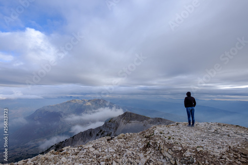 Woman on top of Mount Tomorr, Albania, looking into the distance