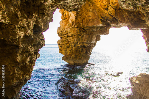 Cova dels Arcs cave, at Moraig cove beach, in Benitatxell, Alicante, Spain photo