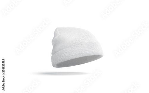 Blank white knitted beanie mock up, isolated, depth of field, 3d rendering. Empty casual headgear mockup. Clear fashion tuque for cold weather template.