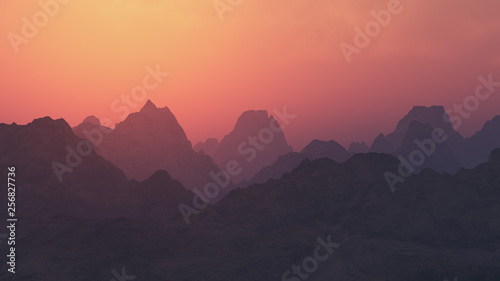 Peaky mountain landscape at cloudy sunset.