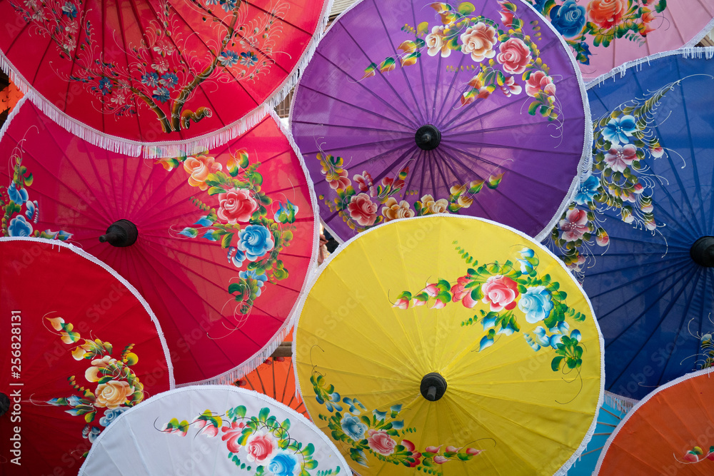 colorful handmade paper umbrella with flower painting. popular and famous Thai handicraft and souvenir.