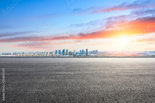 Empty asphalt road ground and modern city skyline in Shanghai