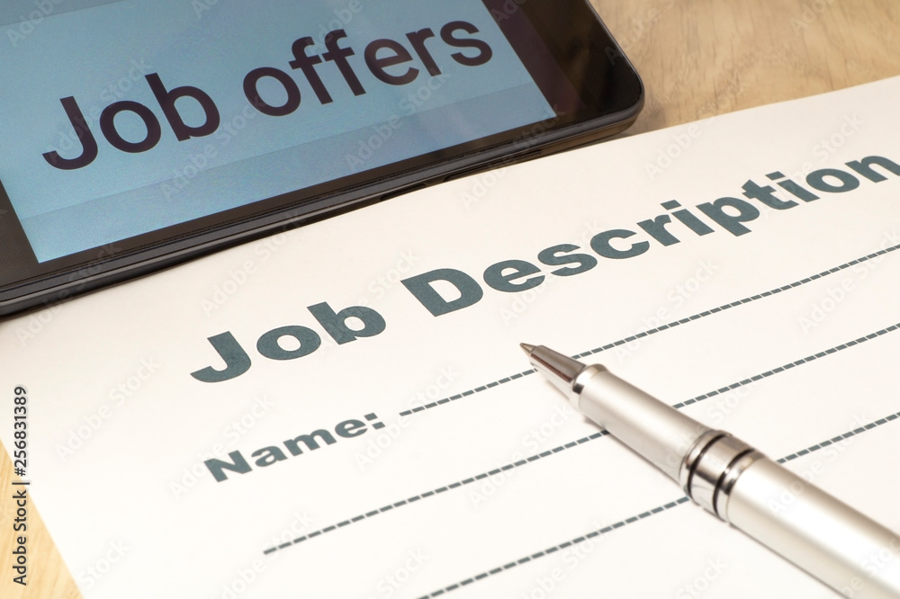 Job Description with smartphone and Pen on the table. Job Description with smartphone and Pen on the table.