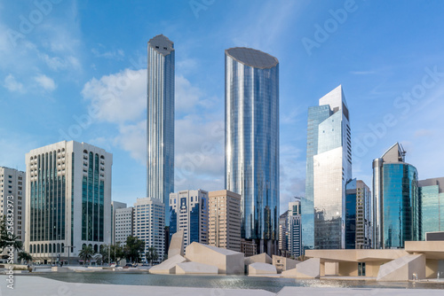 Modern city architecture and famous skyscrapers of Abu Dhabi skyline with beautiful clouds, World Trade Center UAE  © Makaty