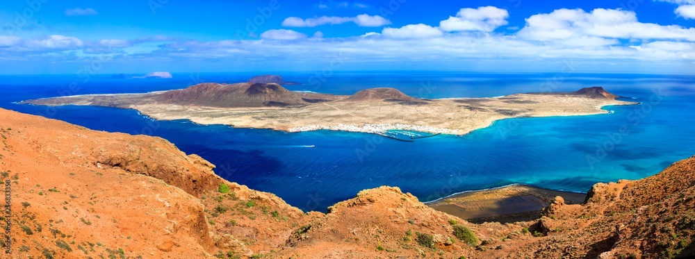 Scenery of volcanic Lanzarote - panoramic view from Mirador del Rio, view of Graciosa island