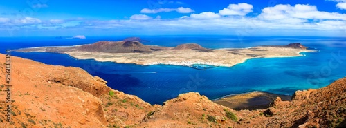 Fototapeta Naklejka Na Ścianę i Meble -  Scenery of volcanic Lanzarote - panoramic view from Mirador del Rio, view of Graciosa island