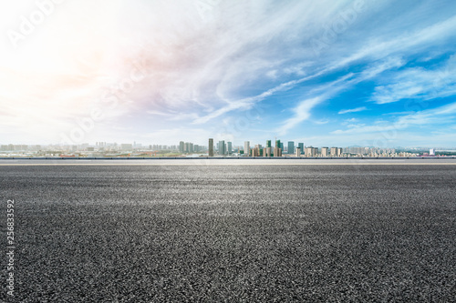 Empty asphalt road passing through the city above in Shanghai