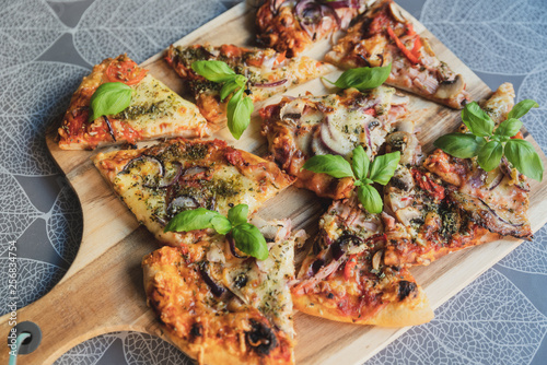 Pizza pieces upcut on a cutting board photo