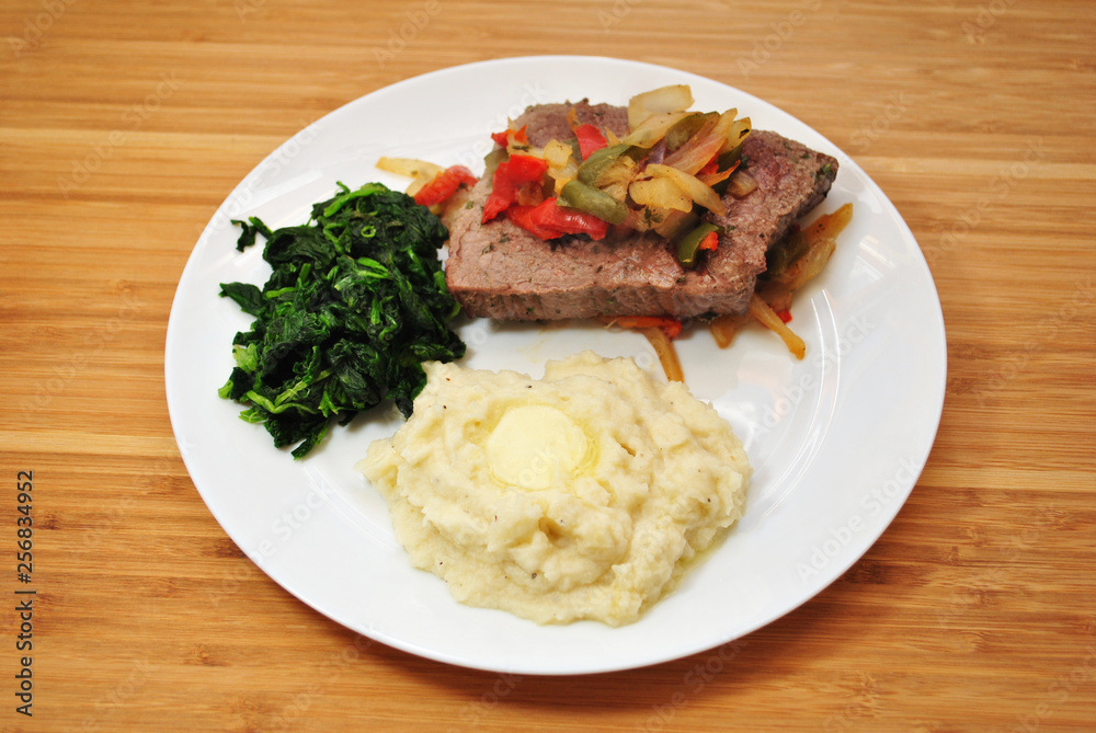 Meal of Mashed Potatoes, Spinach & Beef Steak with Onions and Peppers Meal of Mashed Potatoes, Spinach & Beef Steak with Onions and Peppers