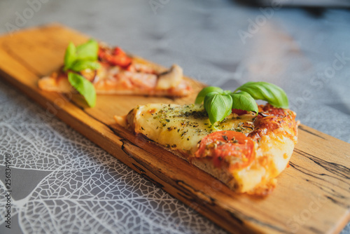 Pizza pieces upcut on a cutting board photo