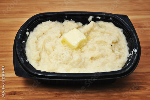 Mashed Potatoes with Butter in a Black Plastic bowl