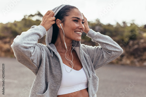 Fototapeta Naklejka Na Ścianę i Meble -  Smiling female on morning walk