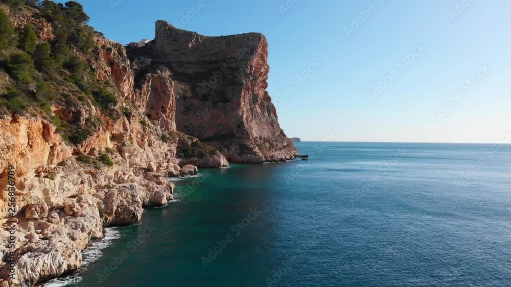 Cliffs in Moraig cove beach in Benitatxell, Alicante, Spain Cliffs in Moraig cove beach in Benitatxell, Alicante, Spain