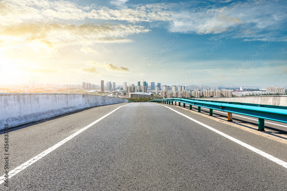 Naklejka premium Asphalt highway passing through the city above in Shanghai at sunset