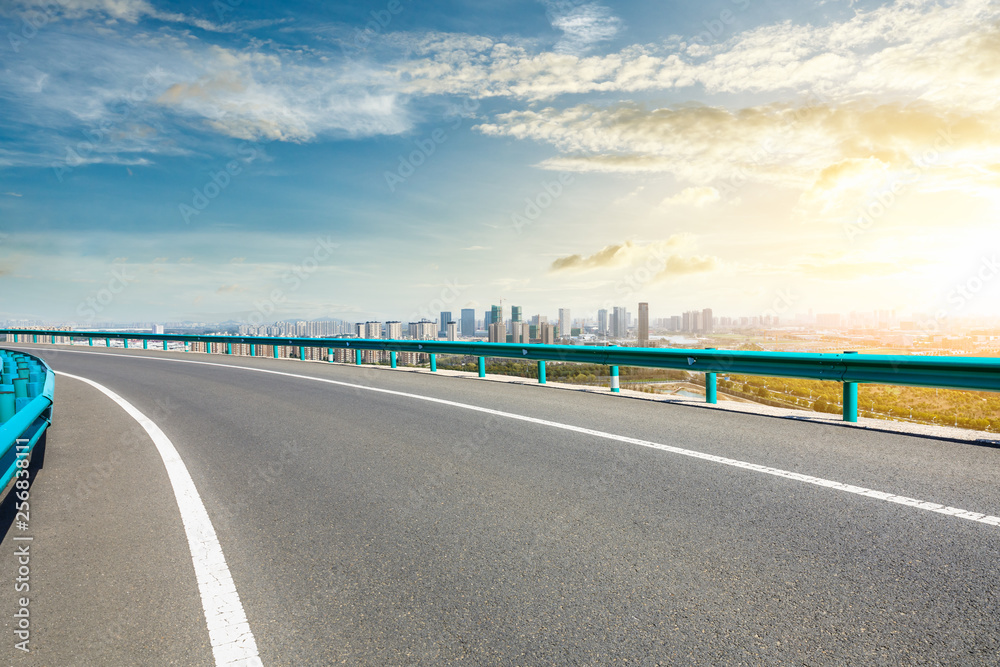 Fototapeta premium Asphalt highway passing through the city above in Shanghai at sunset