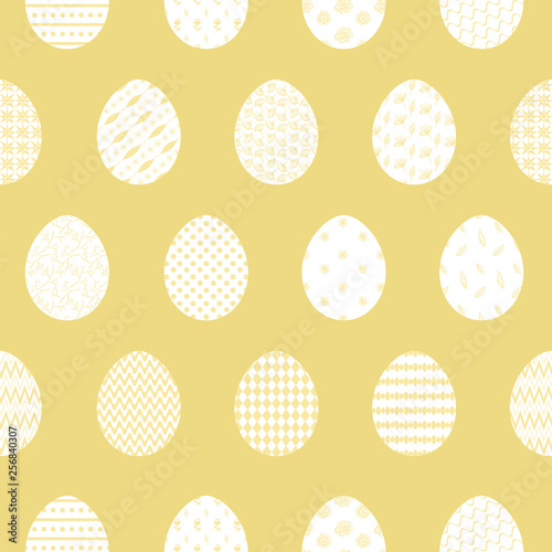 Fresh yellow Happy Easter seamless pattern with white decorated eggs. Bright orange ornamental eggs texture for Easters package, gift wrapping paper, textile, covers, background