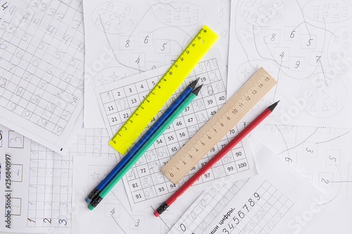 Materials for teaching children to count. Numbers. Mathematics background. Pencils and rulers.