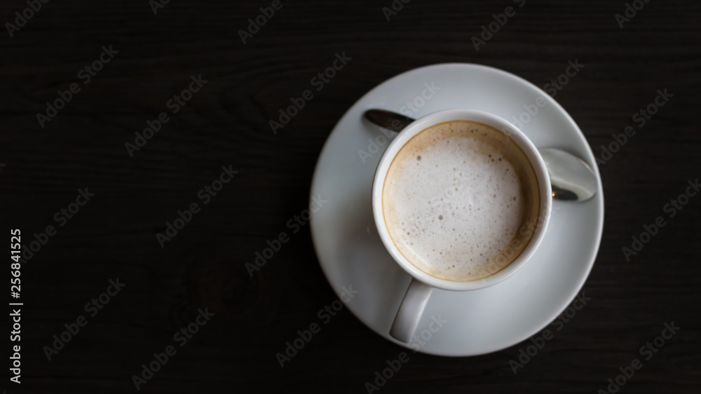 Top view of coffee cup on wood floor. Top view of coffee cup on wood floor.