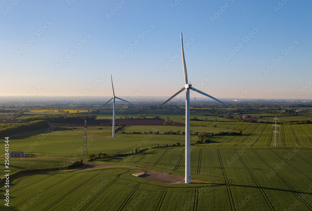 photos of wind turbines providing renewable green energy in england in the country side