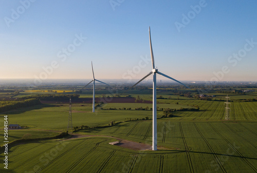 Obraz na płótnie photos of wind turbines providing renewable green energy in england in the country side w salonie