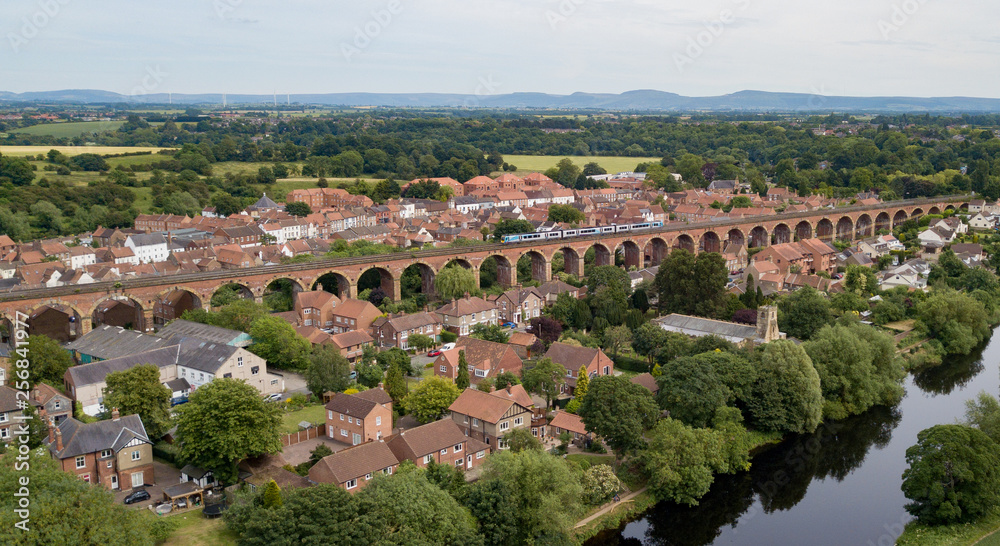 The historic market town of Yarm in North Yorkshire with its red brick railway viaduct