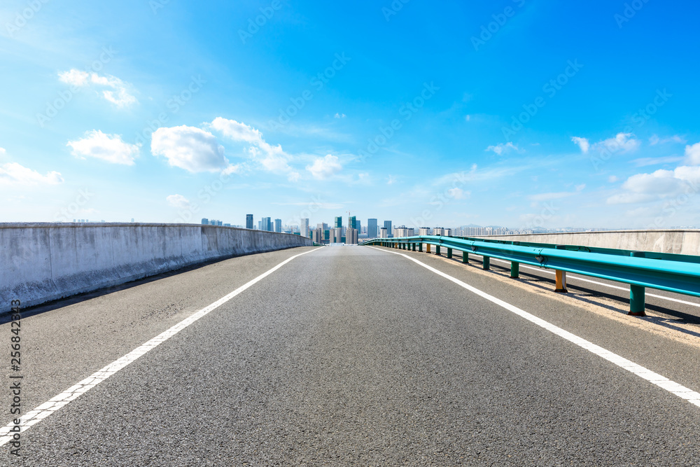 Straight asphalt highway passing through the city above in Shanghai