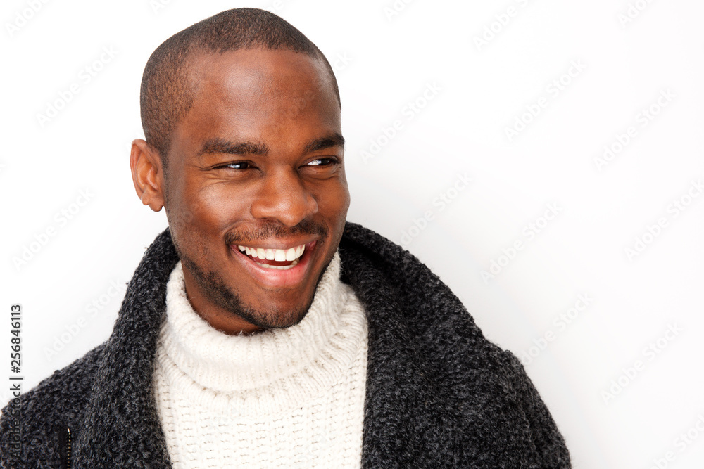 handsome young black man smiling with coat by isolated white background handsome young black man smiling with coat by isolated white background