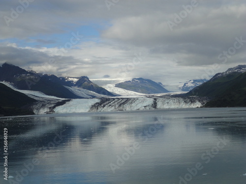 Harvard Glacier College Fjord Alaska Harvard Arm with Snow Covered Mountain Peaks and calm Pacific Ocean with Icebergs from a distance of approx 1 mile