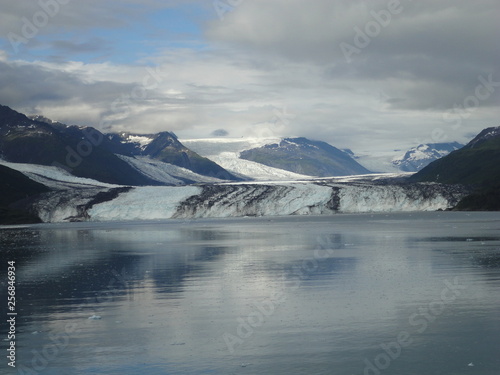 Harvard Glacier College Fjord Alaska Harvard Arm with Snow Covered Mountain Peaks and calm Pacific Ocean with Icebergs from a distance of approx 1 mile © Justin