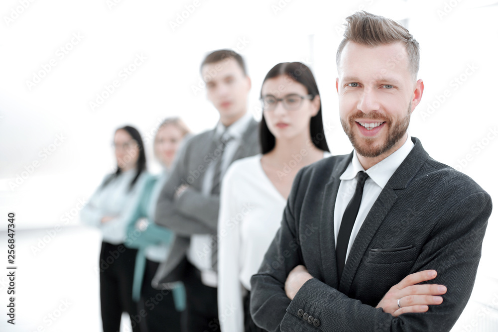 confident businessman standing in front of his business team confident businessman standing in front of his business team