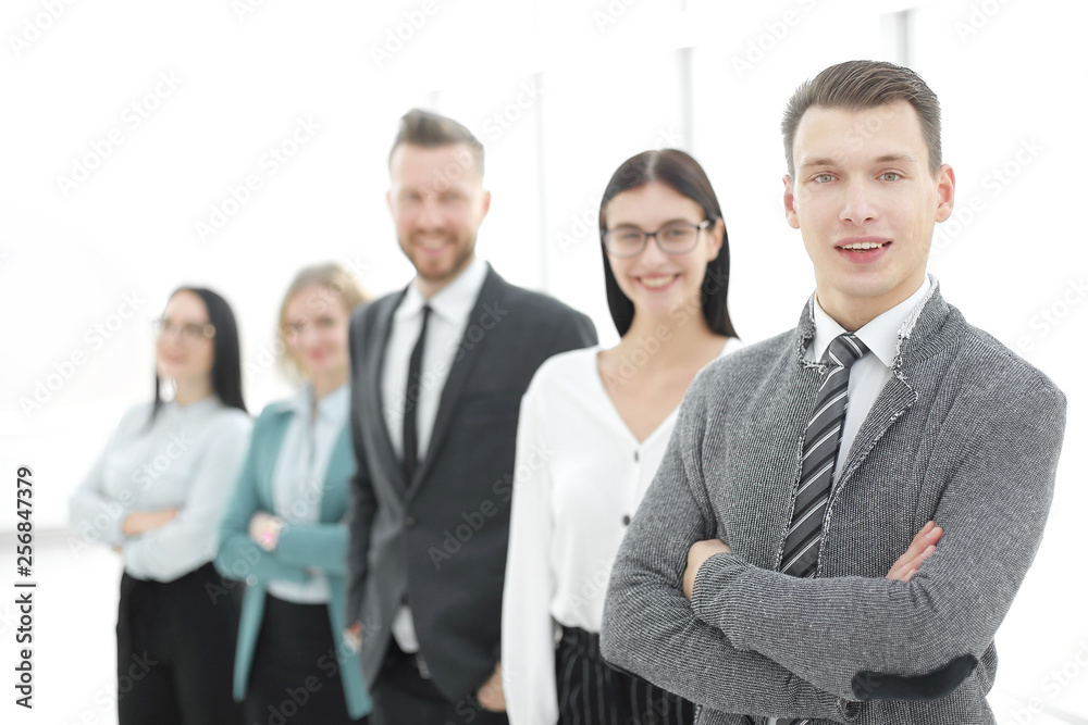 young businessman standing in front of his business team young businessman standing in front of his business team