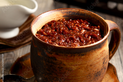 Delicious Cocoa Rice Porridge on the table. Filipino cuisine. Champorado.