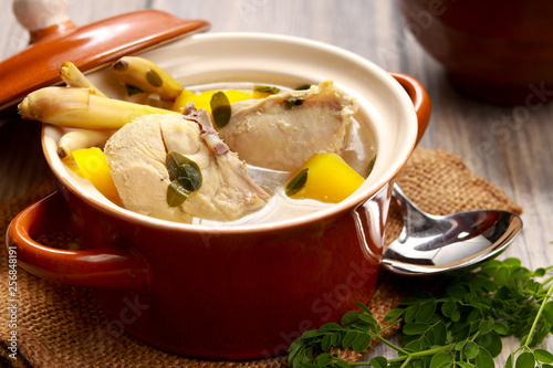 Chicken in Ginger and Lemongrass Broth in a pot. Tinolang Manok from Philipines. photo